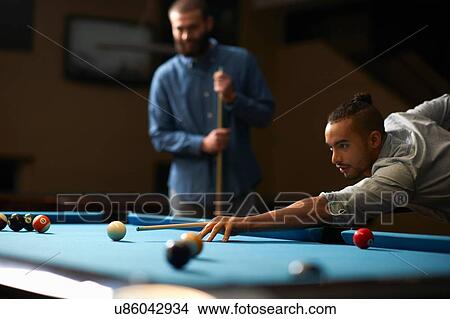 Picture - Man playing pool. Fotosearch