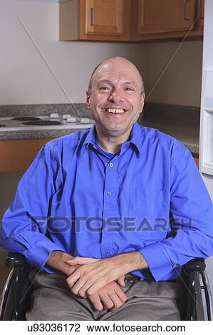 Man with deformed hands in his wheelchair View Large Photo Image Stock Image - Man with deformed hands in his wheelchair. Fotosearch
