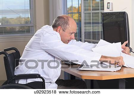 Stock Photo - Man with deformed hands working as doctor. Fotosearch