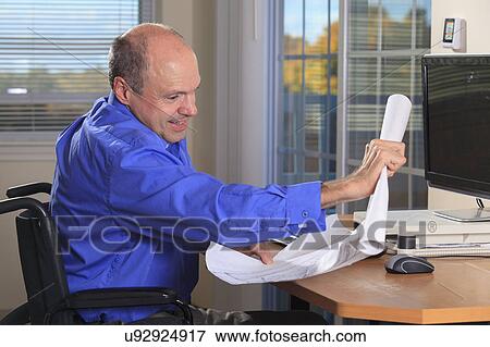 Stock Photo - Man with deformed hands working. Fotosearch