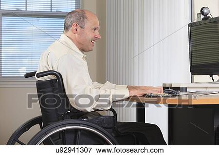 Stock Photo - Man with deformed hands working. Fotosearch