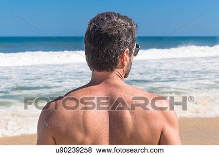 Mature man looking at ocean, rear view, Ipanema, Rio de Janeiro, Brazil View Large Photo Image Stock Photo - Mature man looking at ocean, rear view, Ipanema, Rio de Janeiro, Brazil. Fotosearch