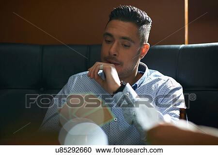 Men playing cards in traditional UK pub View Large Photo Image Stock Image - Men playing cards in traditional UK pub. Fotosearch
