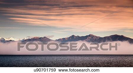Mist and mountains, Lake Maggiore, Piedmont, Lombardy, Italy View Large Photo Image Stock Photo - Mist and mountains, Lake Maggiore, Piedmont, Lombardy, Italy. Fotosearch