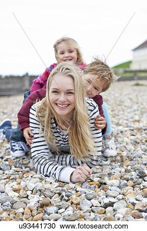Mother with children on beach View Large Photo Image Stock Image - Mother with children on beach. Fotosearch