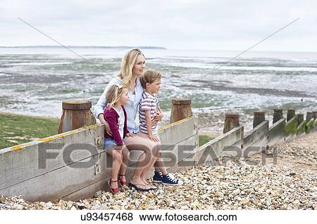 Mother with children on beach View Large Photo Image Stock Photo - Mother with children on beach. Fotosearch