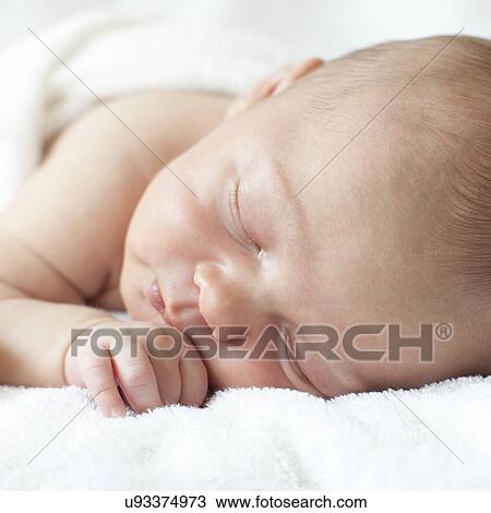 Newborn baby boy asleep View Large Photo Image Stock Image - Newborn baby boy asleep. Fotosearch