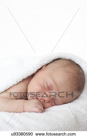 Newborn baby boy asleep View Large Photo Image Stock Image - Newborn baby boy asleep. Fotosearch
