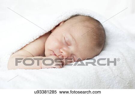 Stock Photography - Newborn baby boy asleep. Fotosearch