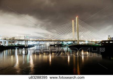 "Night cityscape of Tacoma Narrows bridge and the Narrows, Tacoma, Washington, USA" View Large Photo Image Stock Photography - "Night cityscape of Tacoma Narrows bridge and the Narrows, Tacoma, Washington, USA". Fotosearch
