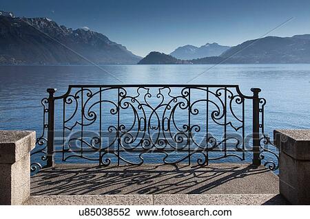 Ornate sunlit iron gate, Lake Como, Italy View Large Photo Image Stock Image - Ornate sunlit iron gate, Lake Como, Italy. Fotosearch
