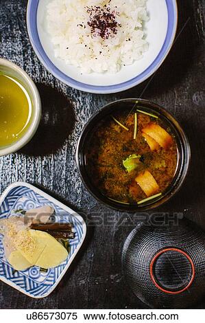 Stock Photography - Overhead view of miso soup, white rice and pickles. Fotosearch