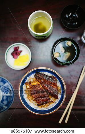 Stock Photo - Overhead view of smoked eel and dipping sauces. Fotosearch