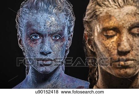Paint covered young women looking at camera View Large Photo Image Stock Photo - Paint covered young women looking at camera. Fotosearch