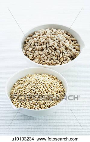 Picture - Pearl barley and Quinoa seeds. Fotosearch