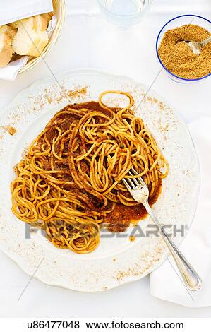 Plate of spaghetti with roasted tomatoes and spicy red pepper on restaurant table, Sicily, Italy View Large Photo Image Stock Photo - Plate of spaghetti with roasted tomatoes and spicy red pepper on restaurant table, Sicily, Italy. Fotosearch