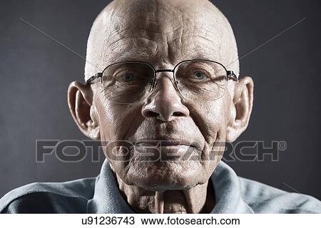 Stock Image - Portrait of a Man wearing glasses. Fotosearch