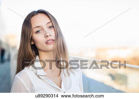 Portrait of beautiful mid adult woman on city walkway View Large Photo Image Picture - Portrait of beautiful mid adult woman on city walkway. Fotosearch