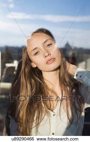 Portrait of beautiful mid adult woman reflected in city window View Large Photo Image Stock Photograph - Portrait of beautiful mid adult woman reflected in city window. Fotosearch
