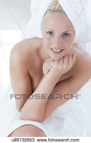 Portrait of beautiful young woman wrapped in a towels View Large Photo Image Stock Image - Portrait of beautiful young woman wrapped in a towels. Fotosearch