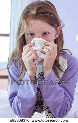Portrait of girl blowing nose with hankerchief View Large Photo Image Stock Photograph - Portrait of girl blowing nose with hankerchief. Fotosearch