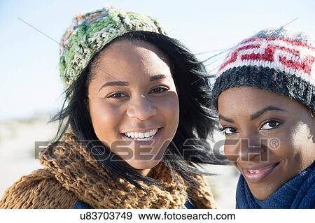 "Portrait of two young women, outdoors, smiling" View Large Photo Image Stock Photo - "Portrait of two young women, outdoors, smiling". Fotosearch