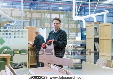 Portrait of worker on motorhome production line View Large Photo Image Stock Photo - Portrait of worker on motorhome production line. Fotosearch
