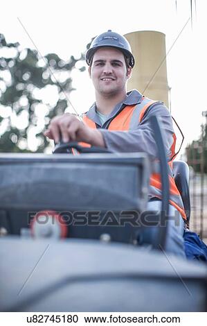 Portrait of young male steamroller driver on construction site View Large Photo Image Stock Image - Portrait of young male steamroller driver on construction site. Fotosearch