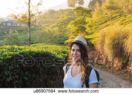 Picture - Portrait of young woman at tea plantations near Munnar, Kerala, India. Fotosearch