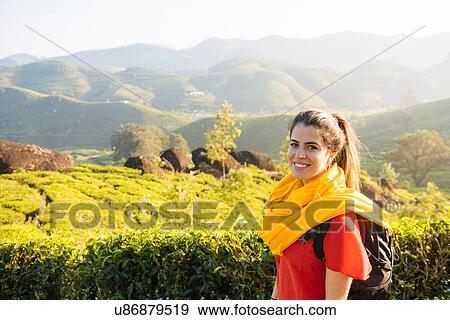 Stock Photo - Portrait of young woman in tea plantations near Munnar, Kerala, India. Fotosearch