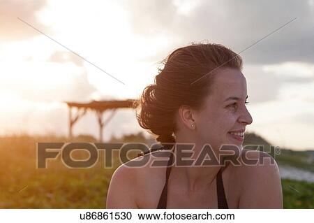 Portrait of young woman looking over her shoulder, Cuba View Large Photo Image Stock Image - Portrait of young woman looking over her shoulder, Cuba. Fotosearch
