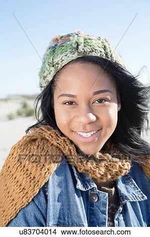 Picture - "Portrait of young woman, outdoors, smiling". Fotosearch
