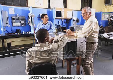 Stock Image - Professor with students. Fotosearch