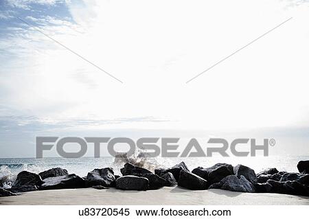 Stock Photography - "Rocks acting as breakers on Palm Beach, Florida, USA". Fotosearch