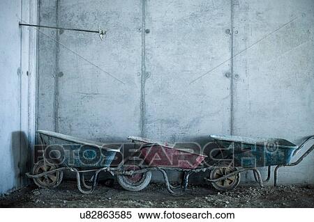 Row of three wheelbarrows on construction site View Large Photo Image Stock Photography - Row of three wheelbarrows on construction site. Fotosearch