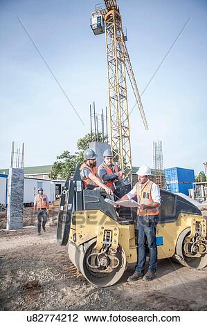 Site manager talking with drivers about blueprint on construction site View Large Photo Image Stock Image - Site manager talking with drivers about blueprint on construction site. Fotosearch