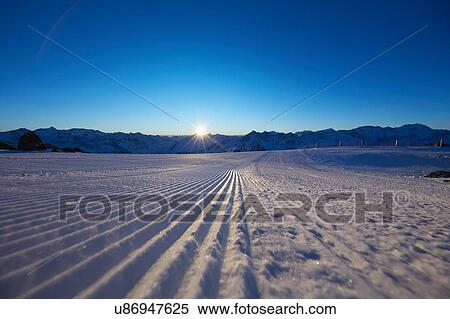 Snow covered field and sunset over mountains, Gaislachkogel, Soelden, Tyrol, Austria View Large Photo Image Stock Photography - Snow covered field and sunset over mountains, Gaislachkogel, Soelden, Tyrol, Austria. Fotosearch