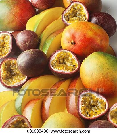 Stack of tropical fruit with mangoes and passion fruit, sliced and whole View Large Photo Image Stock Photograph - Stack of tropical fruit with mangoes and passion fruit, sliced and whole. Fotosearch