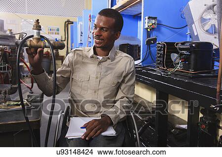 Picture - Student in wheelchair. Fotosearch