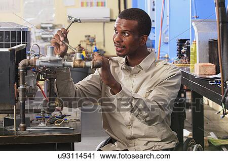 Stock Image - Student in wheelchair. Fotosearch