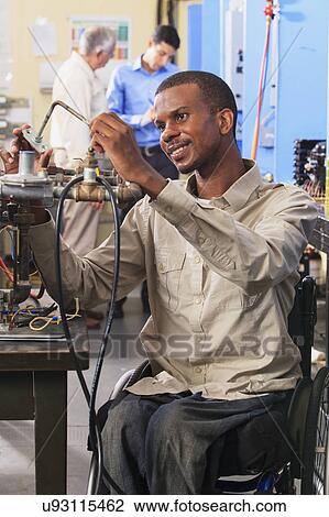 Stock Image - Student in wheelchair. Fotosearch