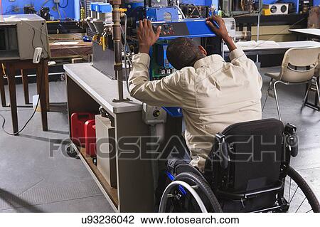 Stock Image - Student in wheelchair. Fotosearch