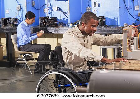Stock Photo - Student in wheelchair. Fotosearch