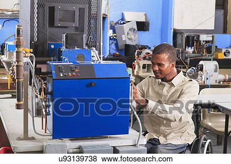 Stock Photo - Student in wheelchair. Fotosearch