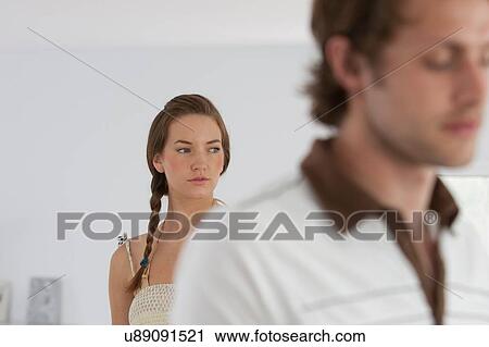 Stock Image - Sullen young couple at home. Fotosearch