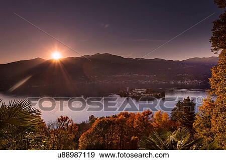 Stock Photo - Sunlit view of Lake Orta, Orta San Giulio, Piedmont, Italy. Fotosearch