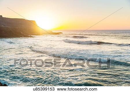 Sunset over sea, Puertito Los Molinos, Fuerteventura, Spain View Large Photo Image Stock Image - Sunset over sea, Puertito Los Molinos, Fuerteventura, Spain. Fotosearch