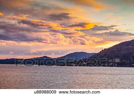 Stock Photo - View of lake at dusk, Leggiuno, Lombardy, Italy. Fotosearch