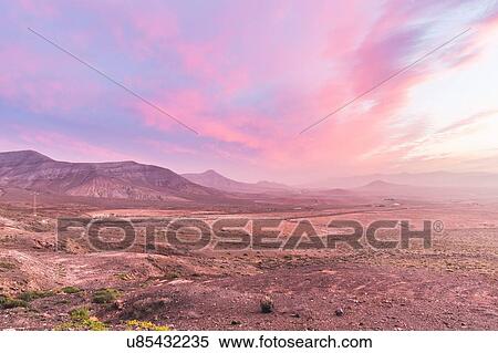 Stock Photography - Volcanic landscape at dusk, La Oliva, Fuerteventura, Spain. Fotosearch