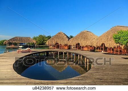 "Waterfront boardwalk and chalets, St. Georges Caye, Belize, Central America" View Large Photo Image Stock Photo - "Waterfront boardwalk and chalets, St. Georges Caye, Belize, Central America". Fotosearch